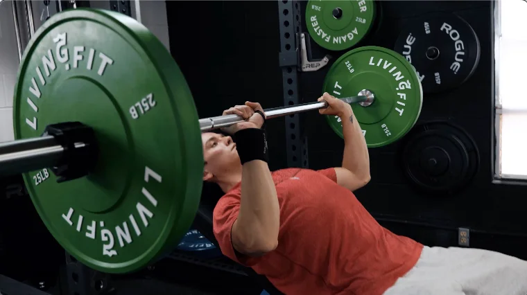 Our tester doing an Incline Bench Press with the Living.Fit Weight Plates.