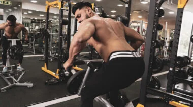 A person performs a T-bar row.
