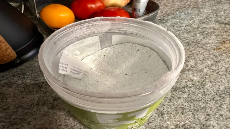 Looking into an opened tub of RYSE Pre-Workout