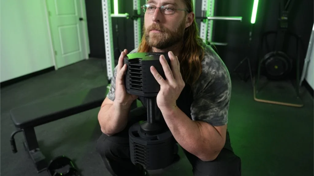 Tester does squats with SMRTFT Nüobell Adjustable Dumbbell