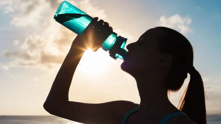 A person drinking water.