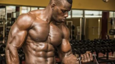Barbend Featured Image A person doing biceps exercises in the gym