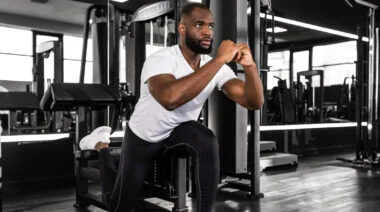 A man performing Bulgarian split squats.