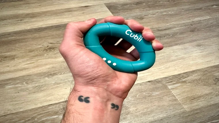 Our tester squeezing the Cubii Squishii Grip Strengthener