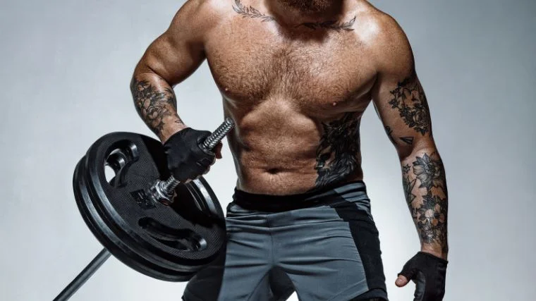 A muscular person doing landmine exercises. 