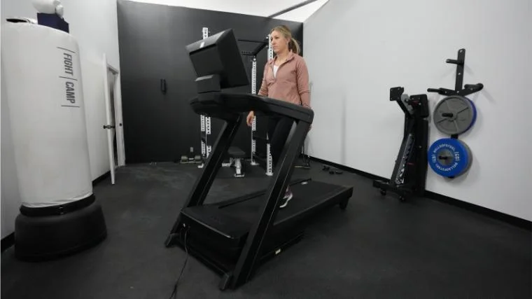 nordictrack-1750-2023-model-walking-front-view A BarBend tester walking on the NordicTrack Commercial 1750.