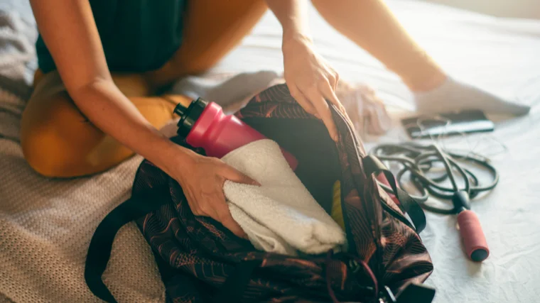 woman packing gym bag