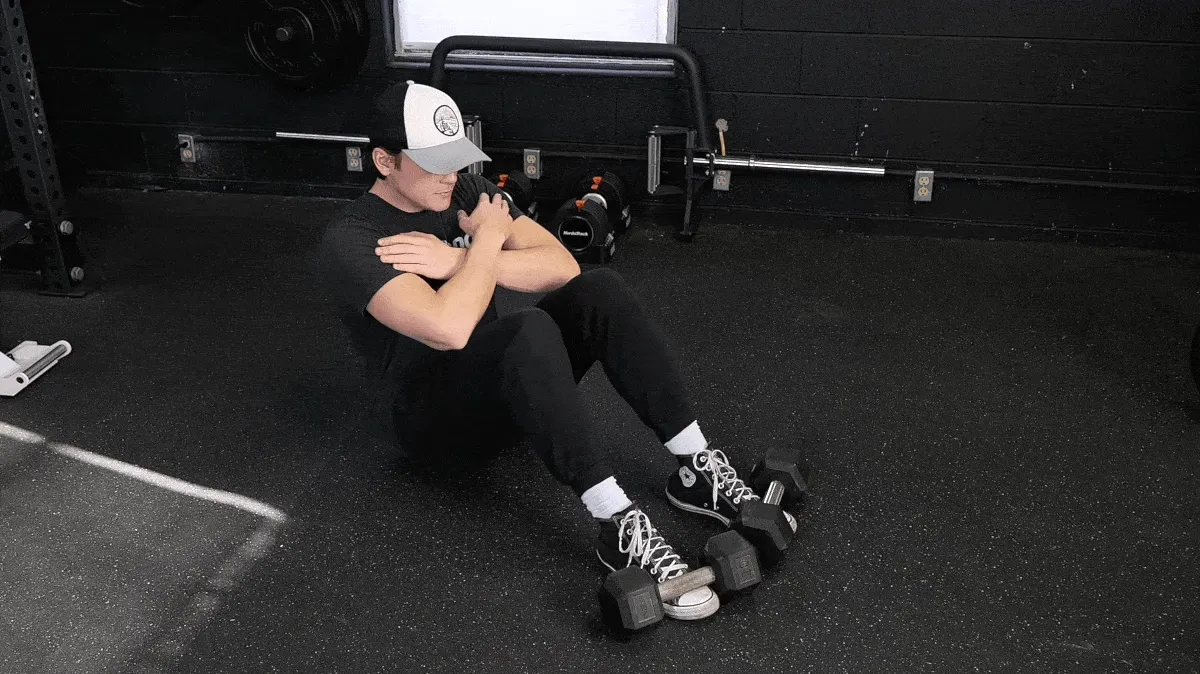 A person doing the bodyweight sit-up.