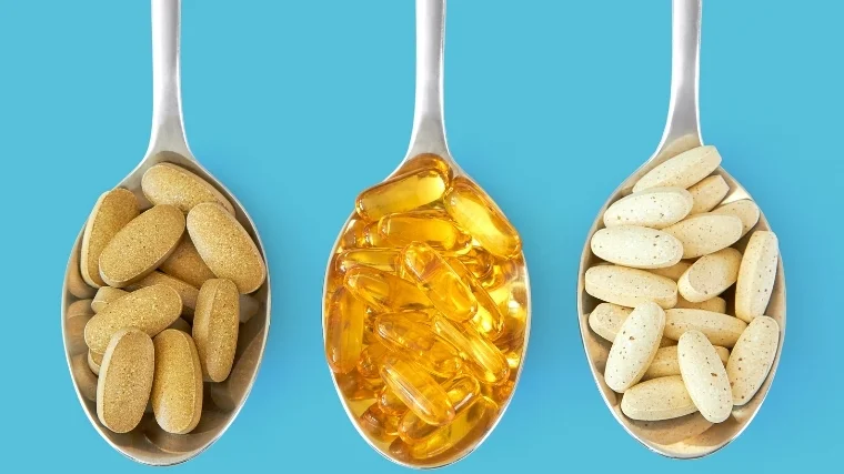 Multivitamins on spoons
