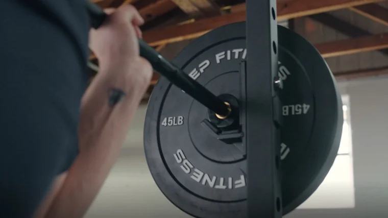 REP Black Bumper Plates on Barbell