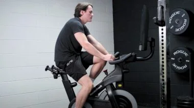 Jake working out on an exercise bike.