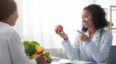 A certified nutritionist giving advice to a client.