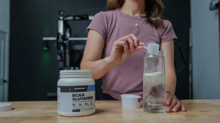 BarBend tester scooping Transparent Labs' BCAA Glutamine