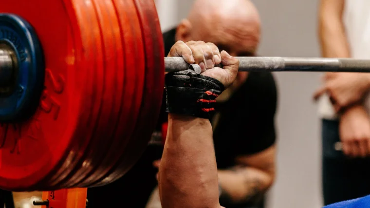 Powerlifter Benching with Wrist Wraps