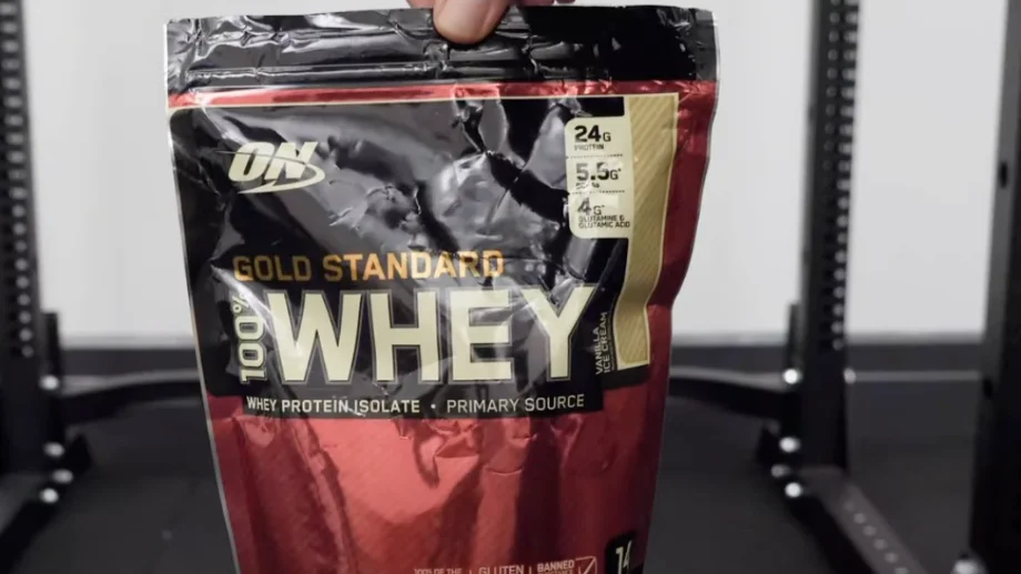 Our tester holding a Vanilla Ice Cream flavored bag of Optimum Nutrition Whey Protein.