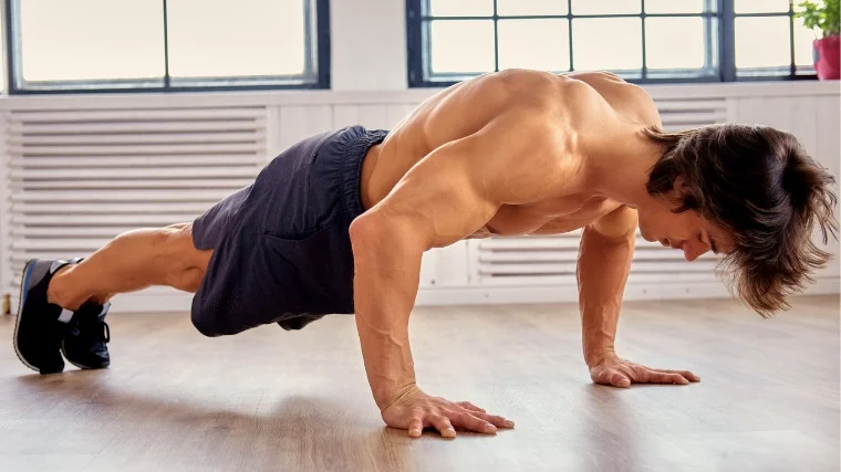 A bodybuilder doing yoga.