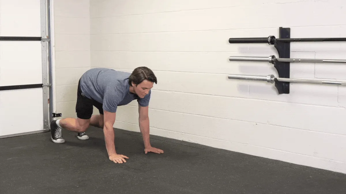 A person doing the bear crawl exercise.