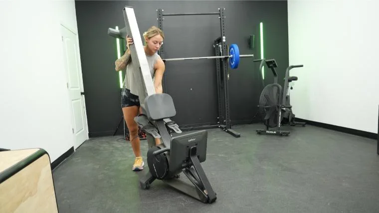 Our tester raising the Hydrow Wave Rower vertically.