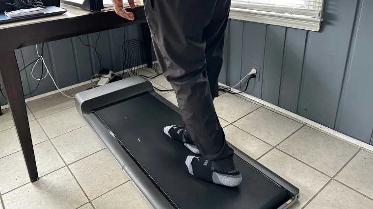 A BarBend tester trying out the WalkingPad at home.