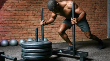 A person performs a prowler push.