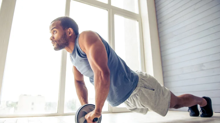 person on an ab wheel