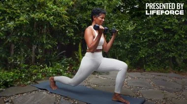 A woman working out with dumbbells