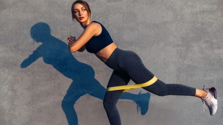 A person using a resistance band to workout.