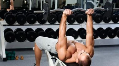A person doing the skull crusher exercise.