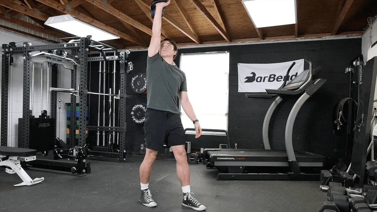 A person doing the kettlebell windmill exercise.
