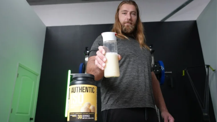 Tester holding Jacked Factory Authentic ISO in a bottle.