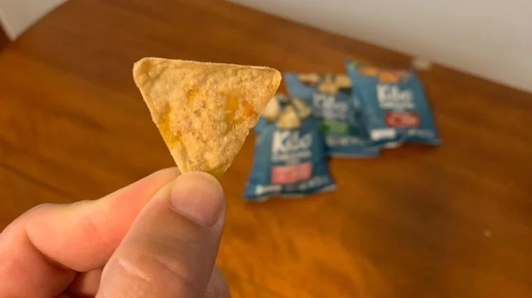 Our tester holding a Kibo Chickpea Chip.
