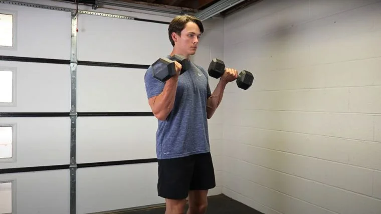 BarBend's Jake Herod performing the zottman curl exercise.