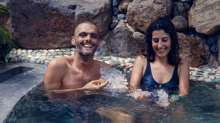 Two fit individuals doing a cold water immersion.