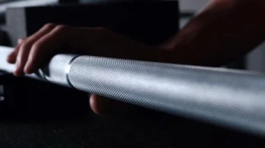Touching a barbell's knurling