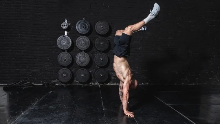 man doing handstand hold