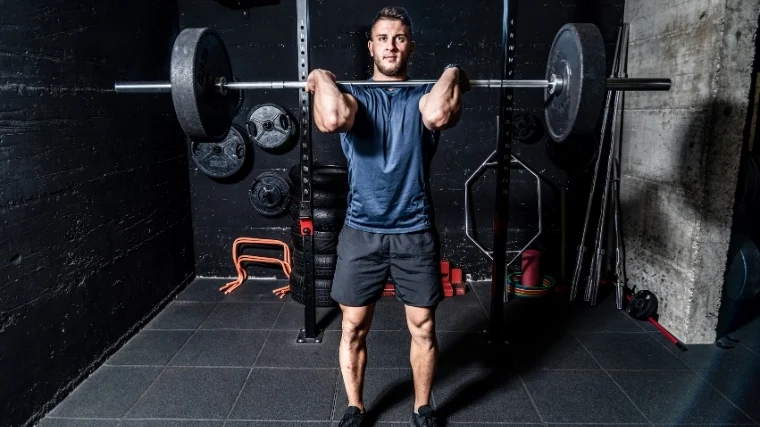 Man performing hang clean