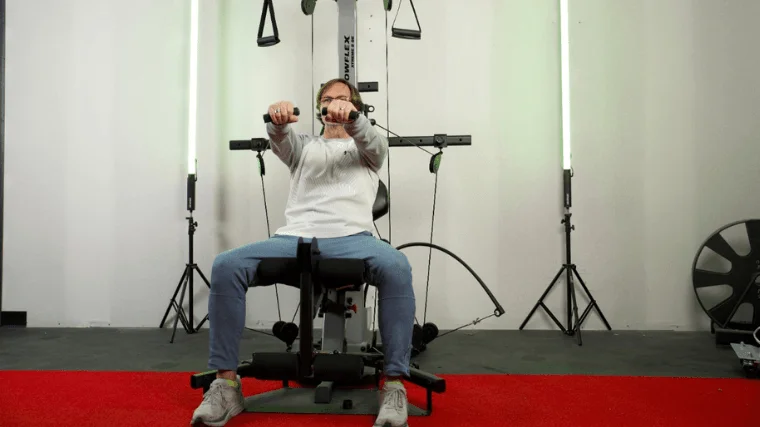 Our tester performing some upper body workouts on the Bowflex Xtreme 2 SE