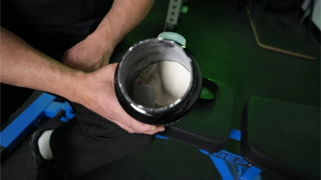 onnit-whey-protein-top-view-open-container Our tester looking down into a container of Onnit Whey Protein