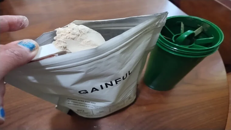 gainful-protein-scoop (1) (1) Our tester grabbing a scoop of Gainful Plant Protein