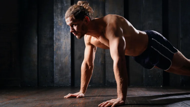 An athlete planking.