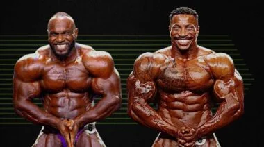 Akim Williams and Patrick Moore pose onstage.