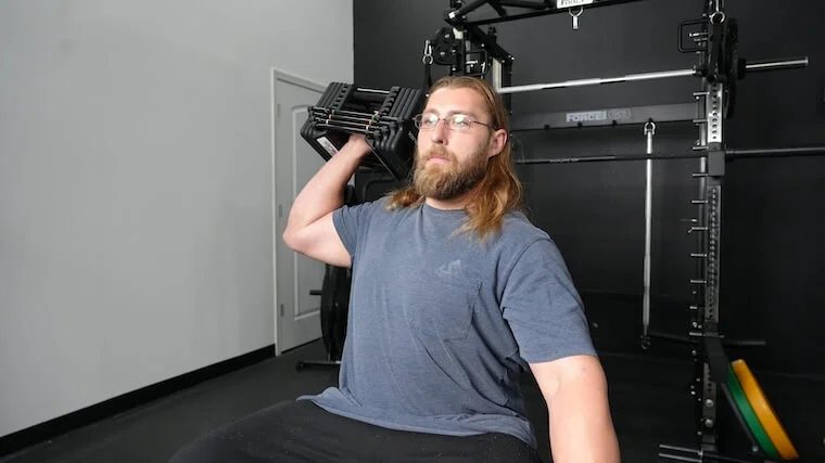 powerblock-pro-100-exp-adjustable-dumbbell-shoulder-press Our tester working out with the PowerBlock Pro 100 EXP Adjustable Dumbbells