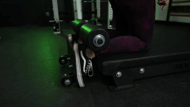 rogue-floor-glute-legs-in-holders A close look at our tester using the leg holders on a Rogue Floor Glute machine
