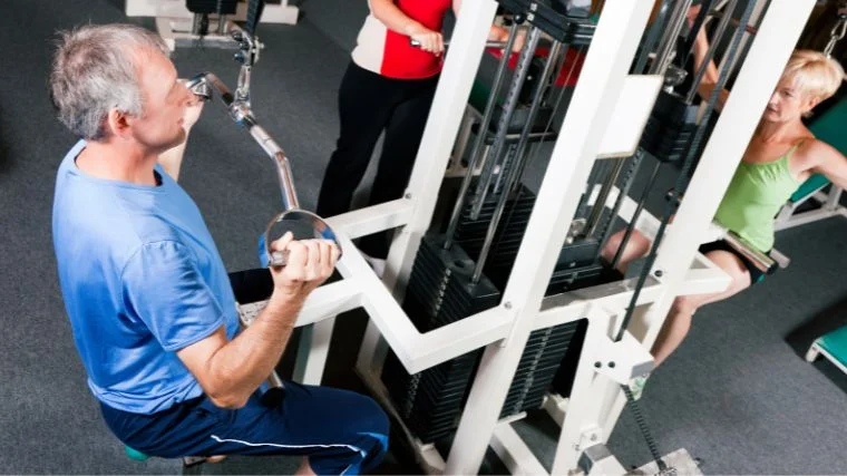 A senior doing the neutral grip pulldown.