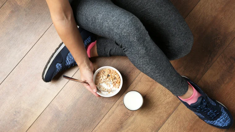 fit girl enjoys granola