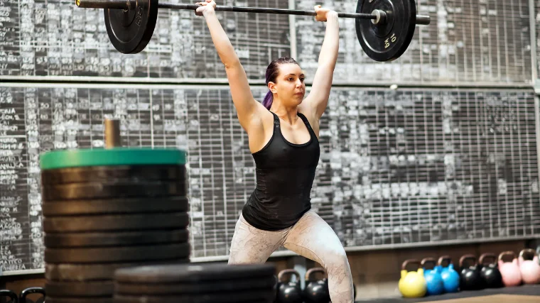 Woman Performs Split Jerk