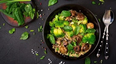 Healthy vegan salad vegetables in a black bowl