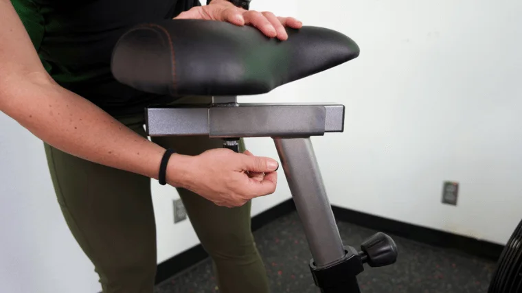 Our tester adjusting the seat of the Xebex AirPlus Performance Bike