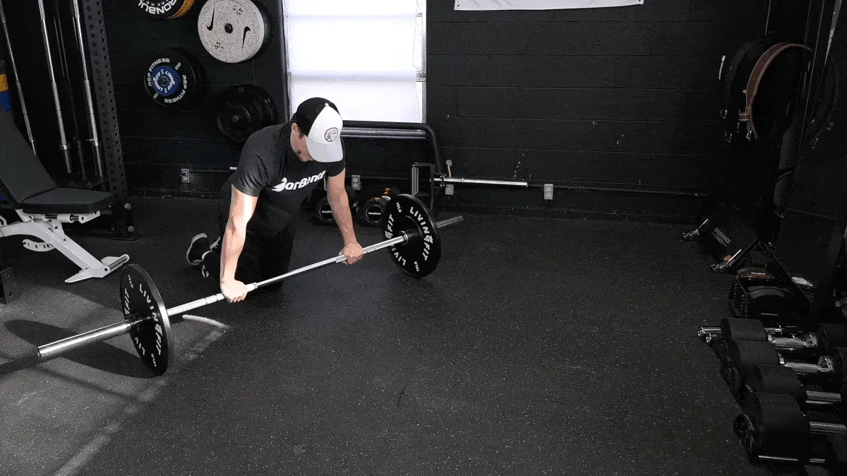 BarBend's Jake Herod performing the ab rollout exercise.