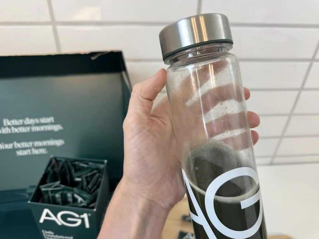 IMG_6875 3 AG1 Next Gen in shaker bottle held by person